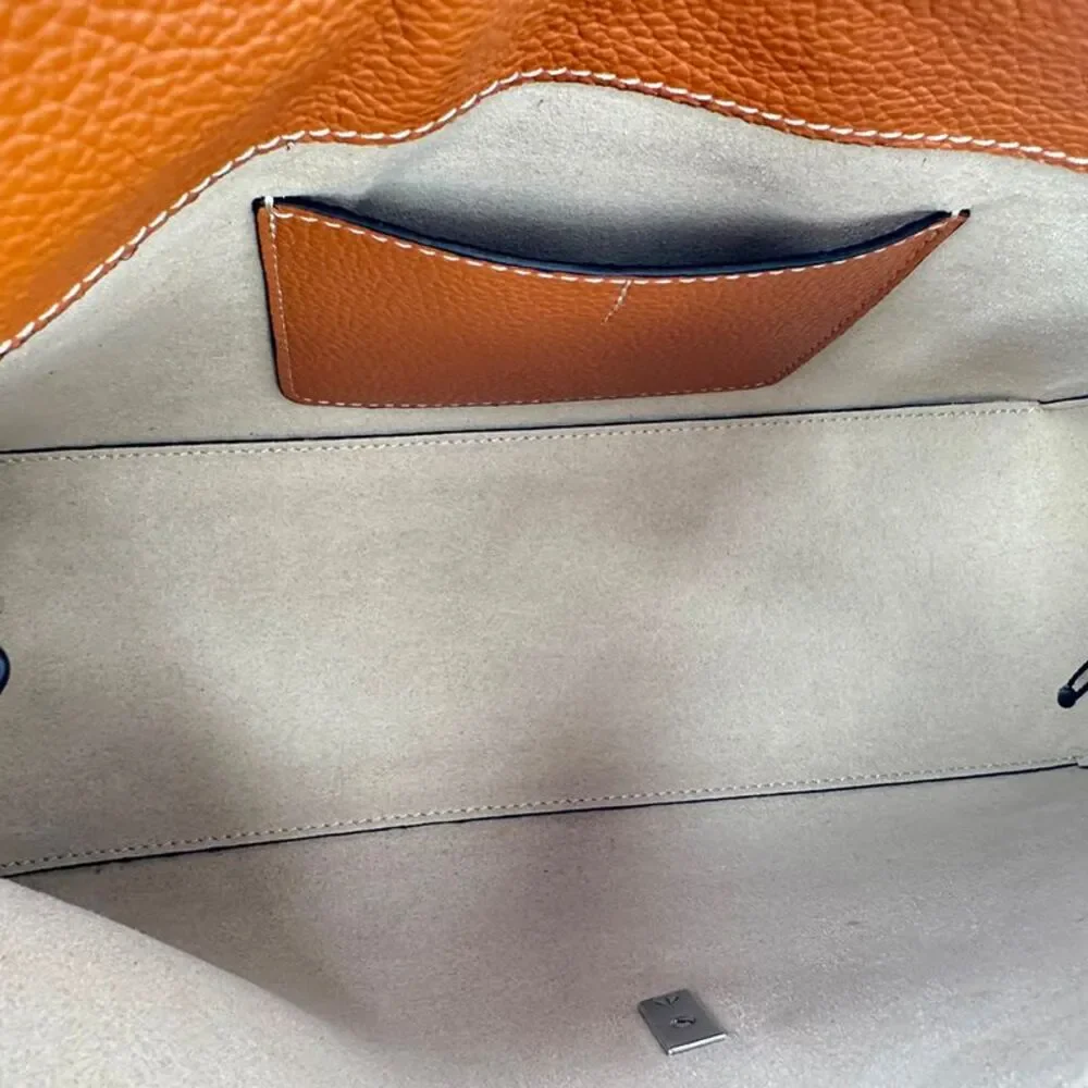 Totême T-Lock Grained-Leather Clutch in Tan Brown Leather